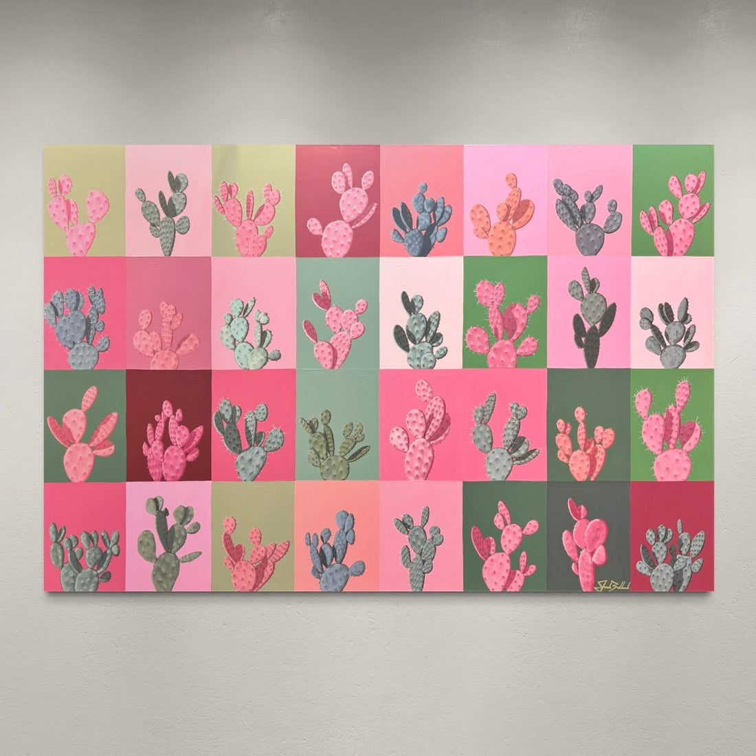 Wall art with a pattern of cacti on a checkered background
