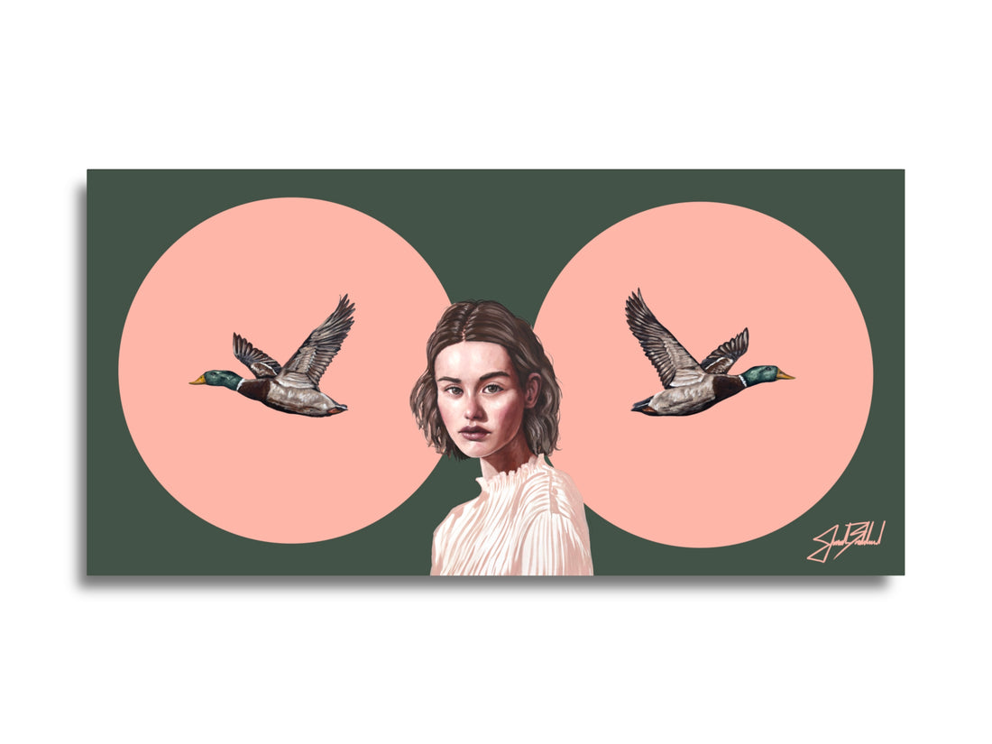 A paper print featuring a portrait of a girl with two ducks flying in the background, set against a green and pink circular background.