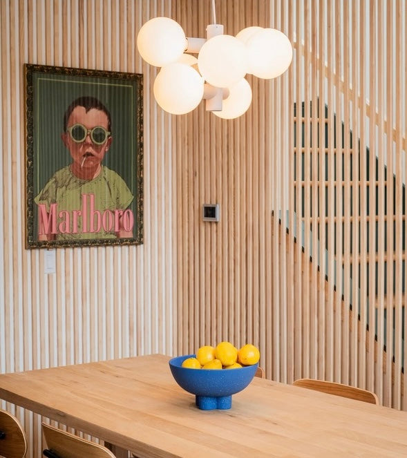 Modern portrait painting hanging in an aesthetically decorated space by Jonah Ballard