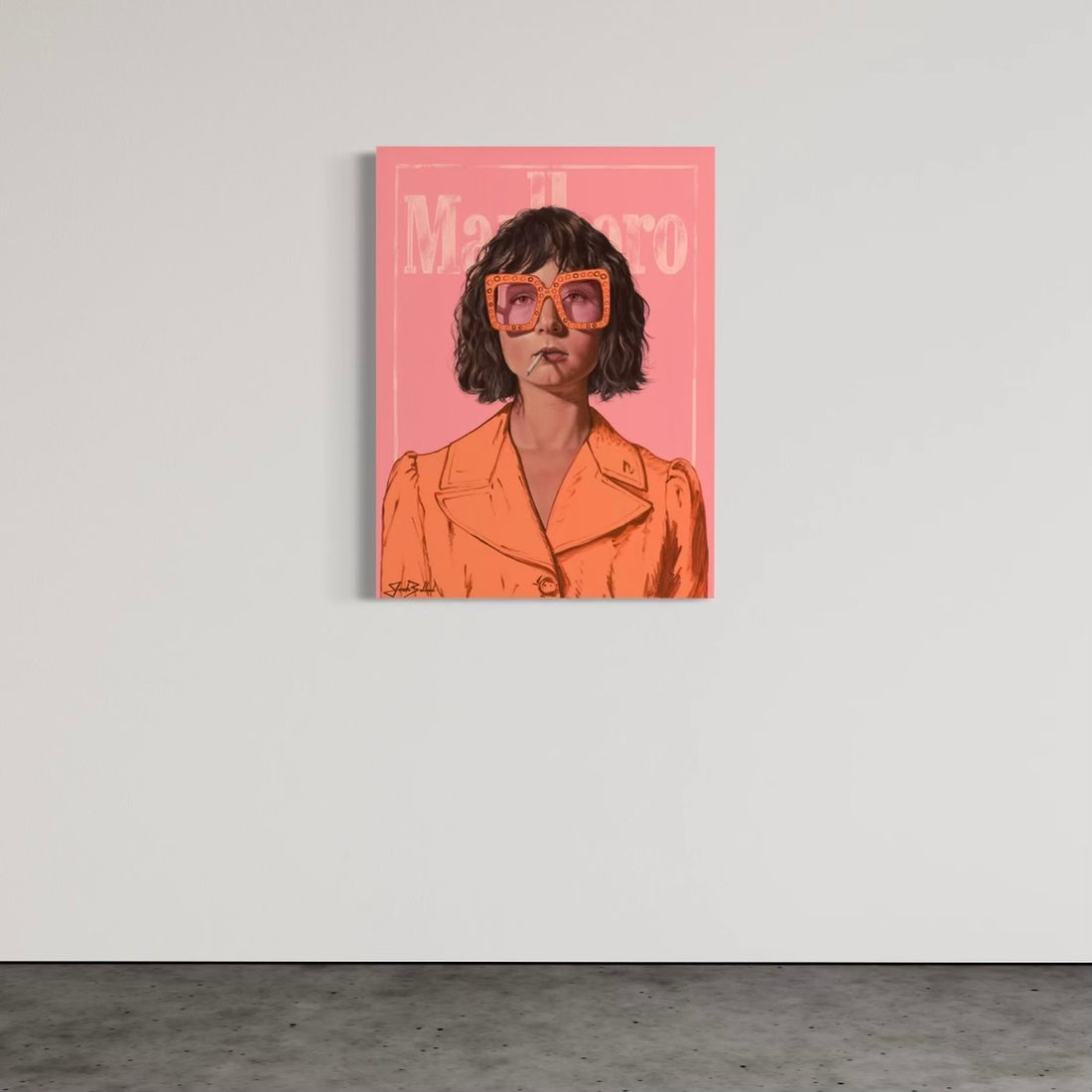 A canvas print featuring a stylized portrait of a woman with sunglasses, predominantly in orange and pink tones, displayed on a wall.