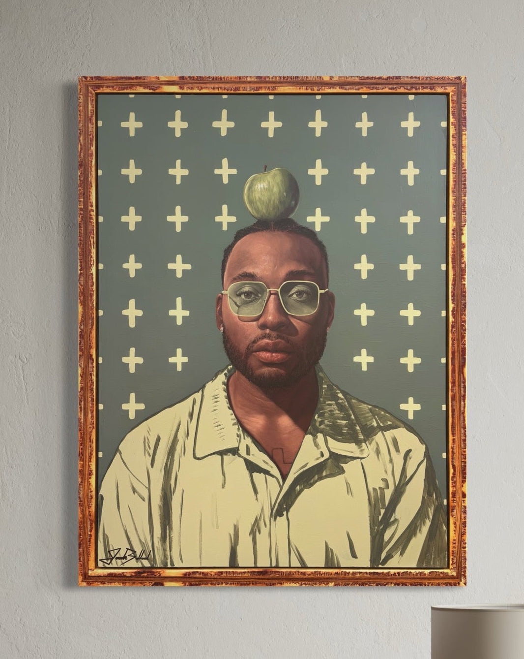 Modern interior with a brown chair, side table, and framed artwork on the wall.
